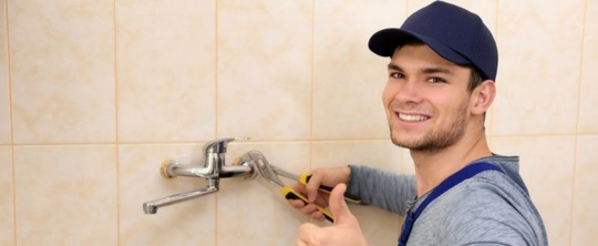 Plumber working on a faucet