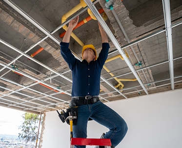 plumber inspecting commercial plumbing