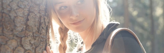 woman hugging a tree