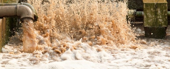 dirty water coming from large pipes