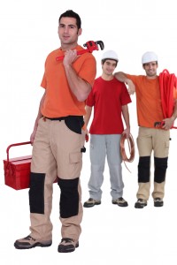 3 plumbers standing together