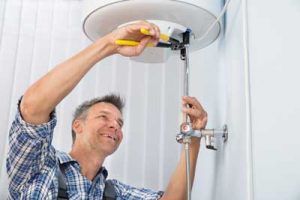 Man working on a water heater