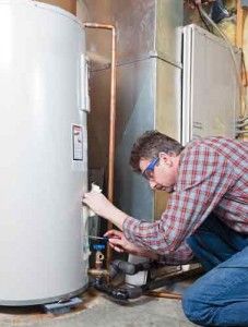 Plumber working on a water heater