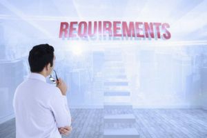 Man staring at a sign that says "requirements"
