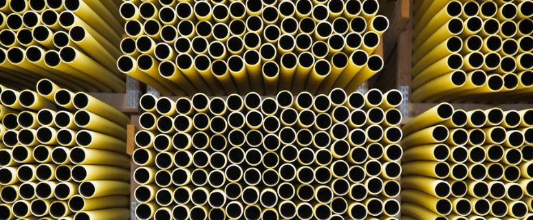stacks of yellow pipes