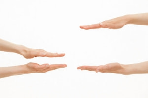 two sets of hands showing measurement, one showing a small amount of distance and the other showing a large amount
