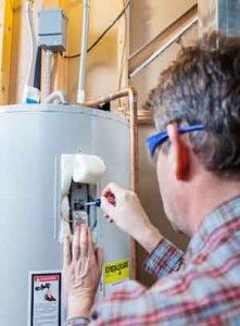 Man working on a water heater